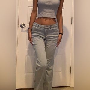 Low waisted, flared, light light blue, thrifted women’s jeans.